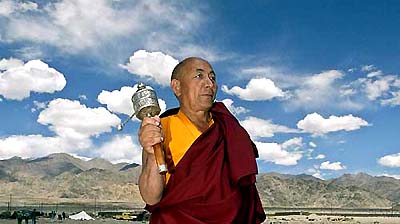 A monk holds a Manay  in Shey, 15 km southeast of Leh