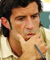 Portuguese soccer star Luis Figo listens to a question during a Press conference in Alcochete