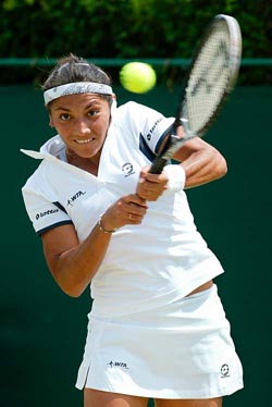 Ninth seed Paola Suarez of Argentina hits a backhand return to Rita Grande 