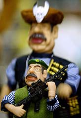 Dolls of the ousted Iraqi leader Saddam Hussein are displayed in a Baghdad toyshop on Tuesday