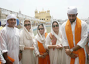 Bollywood actress and member of the Rajya Sabha Jaya Bachchan, along with Mr Anil Ambani, MP, his wife, Tina, and Abhishek Bachchan, comes out of the Golden Temple in Amritsar