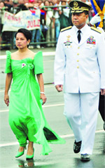 The Philippines President Gloria Macapagal Arroyo walks with Army Chief of Staff Narciso Abaya