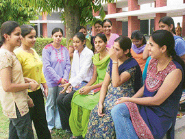 Students in a happy mood on the first day of college at Multani Mal Modi College in Patiala on Monday.