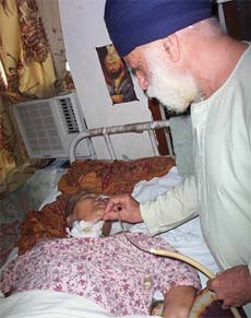 Mr Jagjit Singh Kohli beside his ailing wife at Patiala