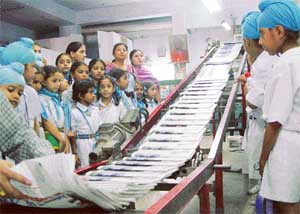 Students of Dashmesh Public Senior Secondary School, Mohali, have a close look at a printing unit of The Tribune publications on Wednesday.