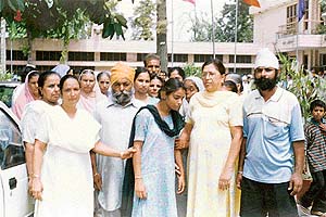 Members of Paramjit’s family and residents of Dashmesh Colony come out of the Municipal Complex after meeting Parliamentary Secretary Sadhu Singh Dharamsot in connection with the disappearance of Paramjit Singh