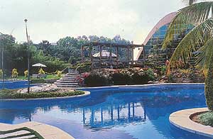 The swimming pool against the backdrop of a food court modelled on the Sydney Opera House.