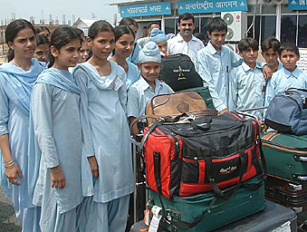 Students of the Guru Hargobind Sahib Academy at the Raja Sansi airport after a two-week visit to the UK on Saturday.
