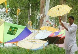 Multi-coloured umbrellas being sold on roadsides in Amritsar are much in demand during the monsoon season