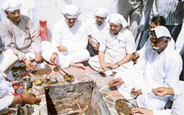MLA Chander Mohan participates in a yagya to please Lord Indra.