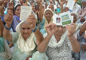 Pensioners hold a protest against non-disbursement of pensions, in Amritsar on Monday