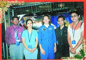 Aaina Jain and her team members with astronaut Sandra Magus