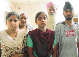 Mr Gurnam Singh with his meritorious children in Ludhiana