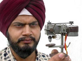 Jasjit Singh of Jalandhar with the world’s smallest drilling machine, after he has designed it and acclaimed his name in the Limca Book of Record.