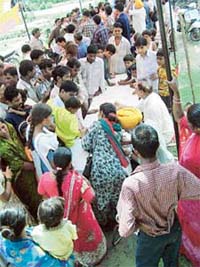 People queue up to give samples of blood to employees of the Health Department in Ludhiana