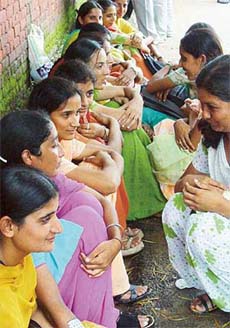 Students of Guru Nanak Nursing Training Institute & Hospital, Jalandhar, sit outside the residence of Punjab Cabinet Minister Rajinder Kaur Bhattal in Chandigarh