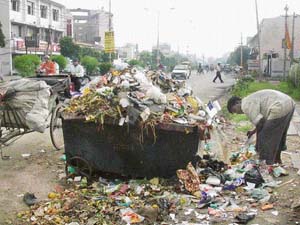 Piles of garbage on city streets is a common sight