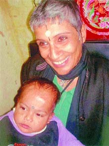 Anuradha Goburdhun Bakhshi with a child at Giri Nagar.
