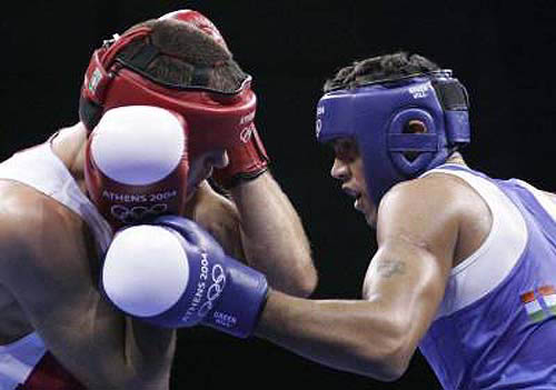 Ukraine's Andriy Fedchuk, left, guards as India's Jitender Kumar