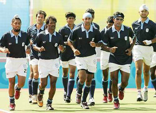 Members of India's field hockey team practice their shots during a training session in Athens on August 11.  Photo by Reuters