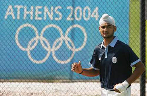 India's Sandeep Singh jogs around the hockey field during a team training session in Athens on August 11.  Photo by Reuters