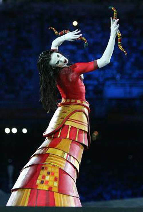 A woman representing the Goddess of Fertility (centre) performs during the opening ceremony of the Athens 2004 Olympic Games