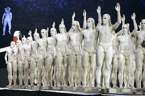 Performers symbolising ancient Greece, wave to spectators during the opening ceremony of the Athens 2004 Olympic Games.  Photo by Reuters