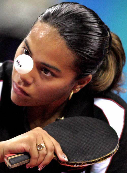 Izzwa Medina of Honduras serves during the women's singles first round table tennis match against Jordan's Zeina Shaban at the Athens 2004 Olympic Games, August 14, 2004. REUTERS/Mike Hutchings