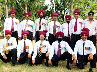 Members of a contingent, based on ex-servicemen from Janauri and nearby villages take part in the state-level Independence Day function at Hoshiarpur