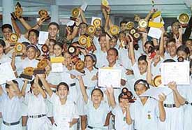 Students of Bhavan Vidyalaya with their prizes during the annual prize distribution