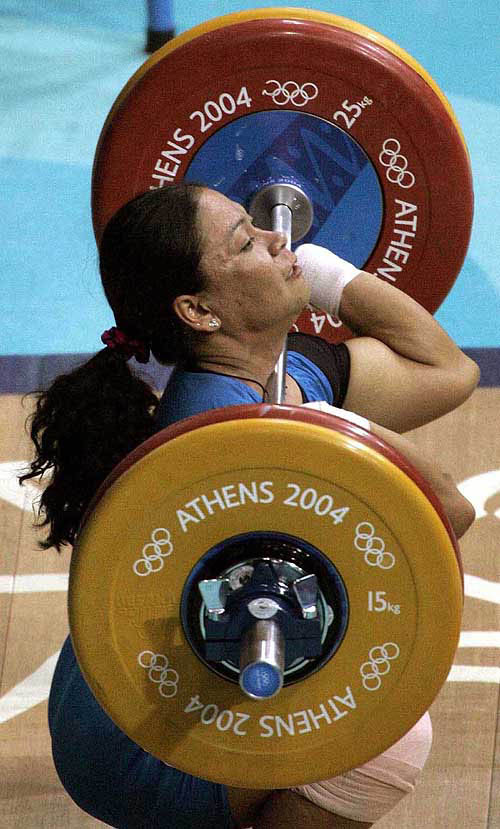 Sanamacha Chanu of India lifts during the women's 53 kg weightlifting event in the Summer Olympic Games in Athens, Sunday, Aug 15, 2004. AP/PTI 