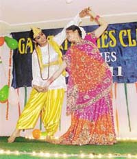 Members of the Gayatri Ladies Club perform a dance at a function
