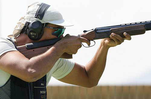 India's Major Rajyavardhan Singh Rathore competes in the men's double trap final of the Athens 2004 Olympic Games in Athens on August 17. Rathore took silver with a score of 179.  Reuters photo
