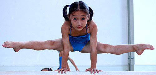 A Chinese gymnast practices on the balance beam at Anhui's sports training centre in Hefei