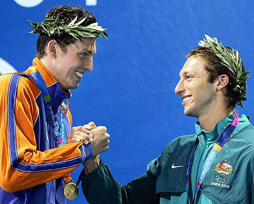 Pieter van den Hoogenband, of the Netherlands, left, gold medallist, celebrates with Australia's Ian Thorpe, who took the bronze, during the medal ceremony for 100-metre freestyle at the Olympic Aquatic Centre during the 2004 Olympic Games in Athens on August 18.