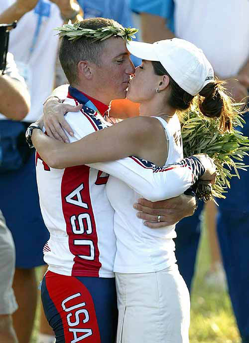 Tyler Hamilton of the US receives a kiss from his wife, Haven, after winning the gold medal in the road individual time trial of the 2004 Olympic Games on the coast in the outskirts of Athens on August 18.