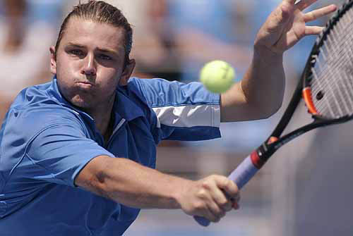 Mardy Fish from the US returns to Juan Carlos Ferrero of Spain during their first round men's singles match at the Athens 2004 Olympic Games on August 17. Unseeded Fish beat 5th seeded Ferrero.