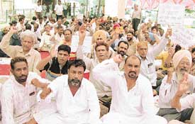 Activists of the Uttariya Railway Mazdoor Union hold a protest rally in support of their demands in Ludhiana