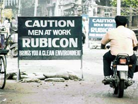 Even though no work is under way for the past two months near Kamla Lohia College, signboards of ‘men at work’ by a private company have not been removed