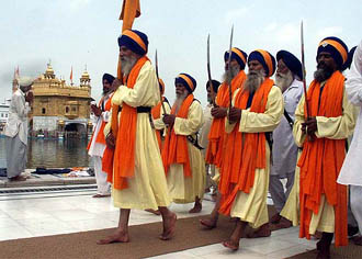 Panj Pyaras from Chandigarh participate in a function held to mark the 400th anniversary of the installation of Guru Granth Sahib