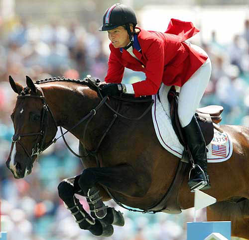 Beezie Madden of the USA jumps the fence ridding on Authentic during the individual second jumping qualifier of the Athens 2004 Olympic Games at the Markopoulo Equestrian Centre in Athens on August 24.