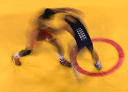 India's Khatri Mukesh (red) wrestles Poland's Jablonski Dariusz during men's Greco-Roman 55kg elimination round during the Athens 2004 Olympic Games on August 24.