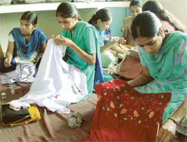 Girls learn the art of phulkari. 