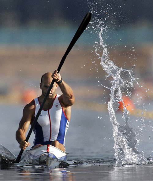 Water trails off the paddle of British canoeist Ian Wynne as he heads for a first place in the semi-final of the men's K1 500-metre during competition at the Athens 2004 Olympics on August 26. Wynne placed first and advances to the gold medal race.