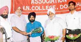 Commerce students of Guru Nanak National College, Doraha, attend a lecture at the seminar hall of the college