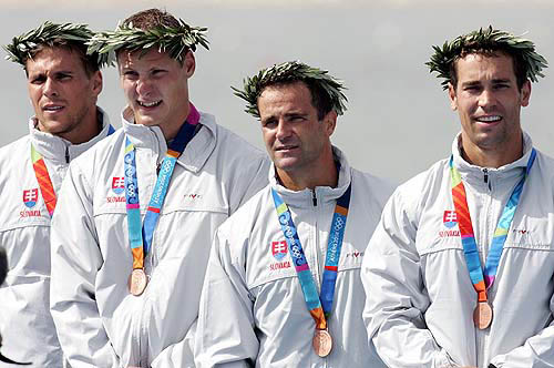 Slovakia's kayak bronze medallists Richard Riszdorfer, Michal Riszdorfer, Erik Vlcek and Juraj Baca display their medals on the podium after the men's K4 1000 metres finals at the Athens 2004 Olympic Games on August 27.