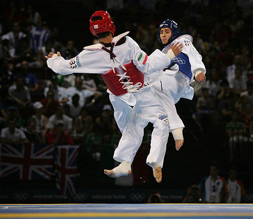 Iran's Yossef Karami and Daniel Trenton of the US fight during the men's under 80 kg quarter-final taekwondo event 