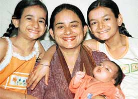 Lovepreet with her three daughters, all born on August 6, at their Phase IX residence in Mohali