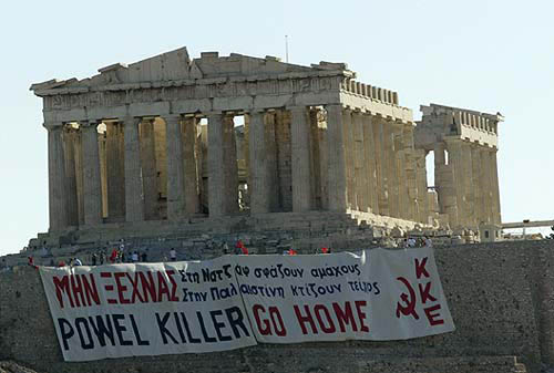 Greek activists' banner on the Acropolis saying "Powel killer go home" hours before a scheduled visit by the U.S. Secretary of State Colin Powell to Greece August 28, 2004. U.S. Secretary of State Colin Powell cancelled plans to attend the Olympics closing ceremonies in Greece because of the "press of business" including crises in Iraq and Sudan, U.S. officials said on Saturday. The decision was unrelated to anti-U.S. protests by about 1,000 people in Athens on Friday that were broken up when police hurled tear gas at demonstrators headed toward the U.S. Embassy, said U.S. State Department spokesman Kurtis Cooper. REUTERS/John Kolesidis