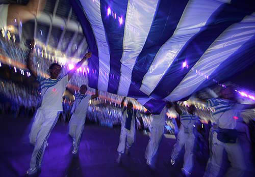 Greek Athletes dance during the closing ceremony of the Athens 2004 Olympic Games August 29, 2004. The next summer Olympic Games will be held in Beijing in 2008. REUTERS/Eric Gaillard